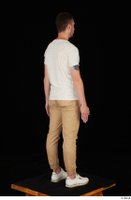  Trent brown trousers casual dressed standing white sneakers white t shirt whole body 0014.jpg